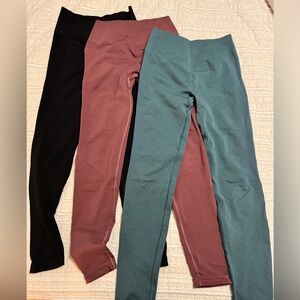 3 pair Alphalete Women’s seamless scrunch leggings.